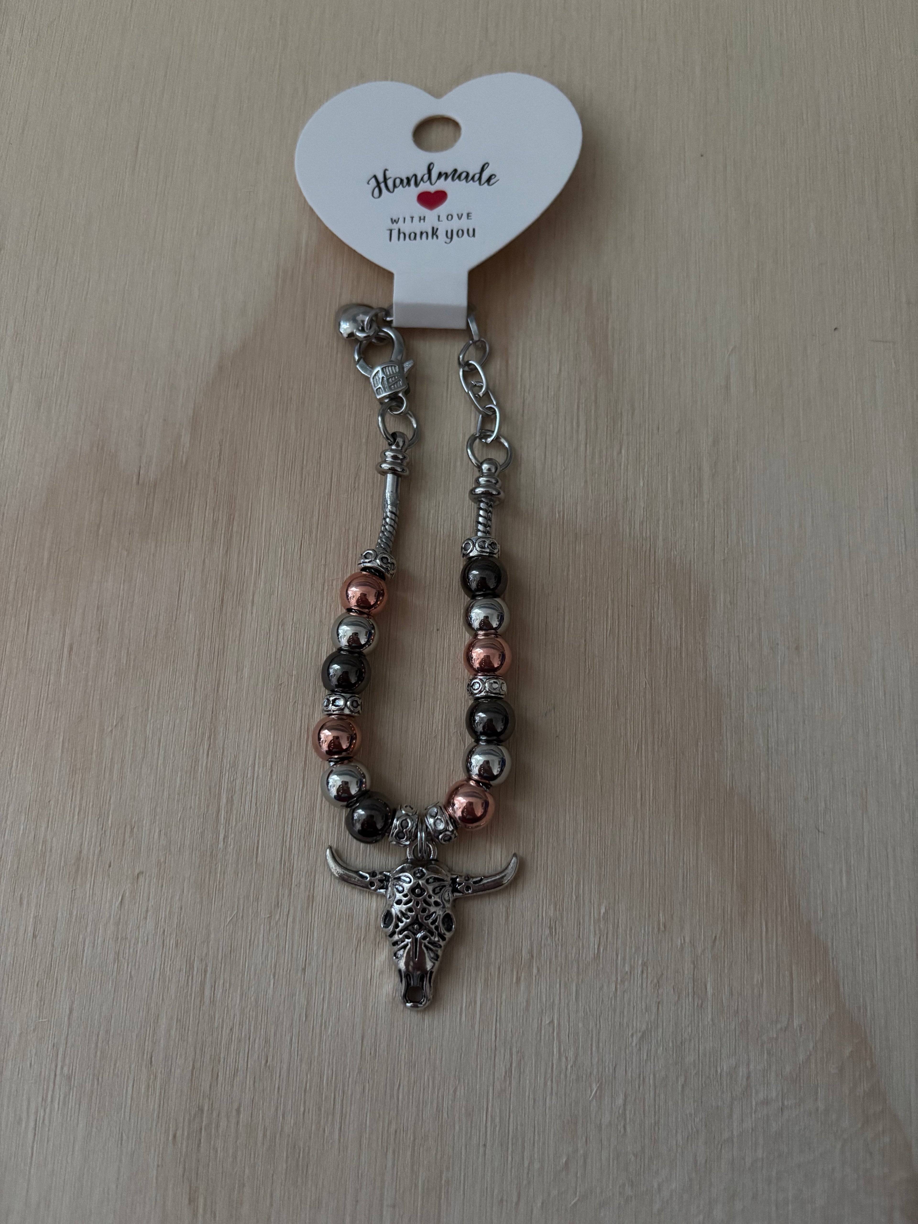 Skull Charm with Copper, Silver, and Black Beads